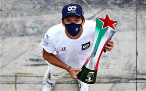 French racing driver, Pierre Gasly holding his first F1 racing trophy